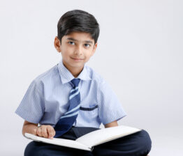 124419360-indian-asian-school-boy-with-note-book-and-studying